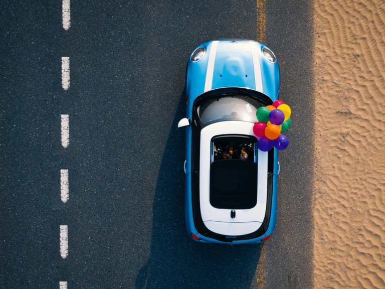 A blue car pictured from the top view