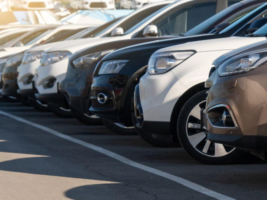 Row of well-maintained vehicles highlighting condition and car resale value in the used car market.