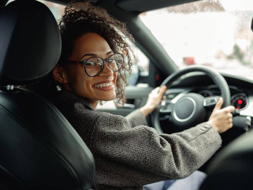 Happy driver enjoying reliable vehicle ownership.