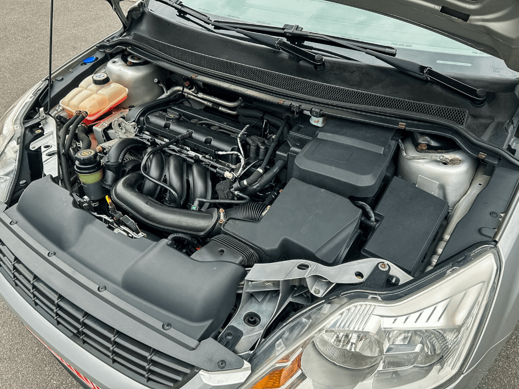 Open car bonnet revealing a freshly cleaned and detailed engine compartment.