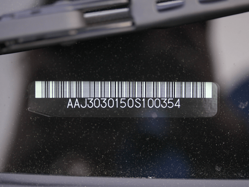 VIN barcode displayed on a car windscreen for verification when buying a used car.